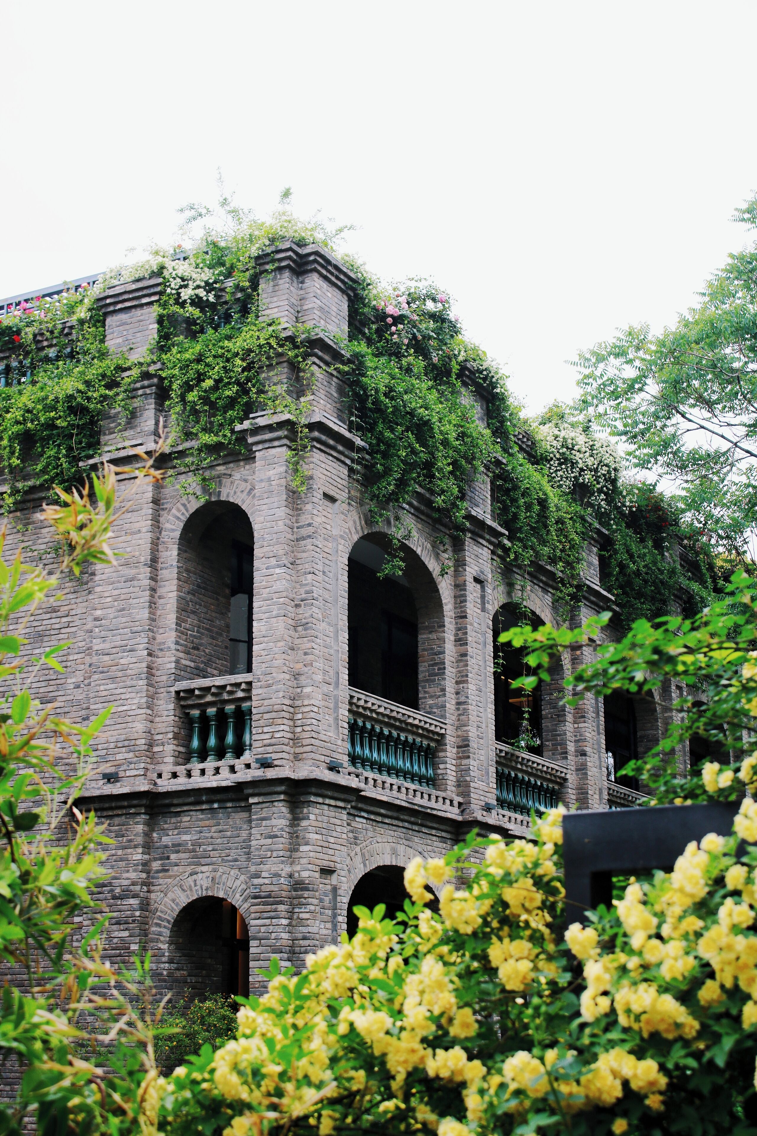 A historic building with arched windows and a balcony.