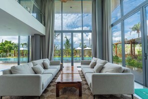 Comfort Villa, Balcony, Garden View | Living area | 65-inch LCD TV with cable channels, fireplace, heated floors