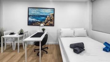 Desk, travel crib, free WiFi, bed sheets