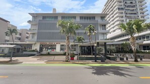 A modern building with a restaurant named "Oriental Food & Arts" on the ground floor. - La Rada 222 | Studio Apt in San Juan With Views (San Juan)