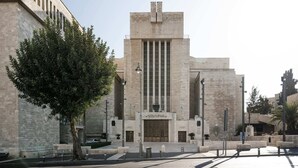 A building with a central tower, large windows, and a plaque. - Chic 3 Keren Hayesod (Jerusalem)