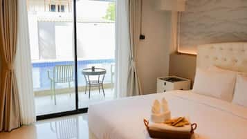 Deluxe Room, Pool Access | Blackout drapes, free WiFi, bed sheets