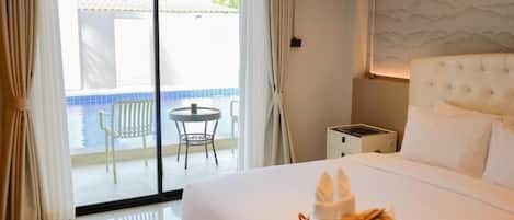 Deluxe Room, Pool Access | Blackout curtains, free WiFi, bed sheets