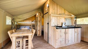 A tented accommodation with a wooden dining table, a bunk bed, and a kitchenette. - Comet Glamping Tent, Ardennes (Signy-l’Abbaye)