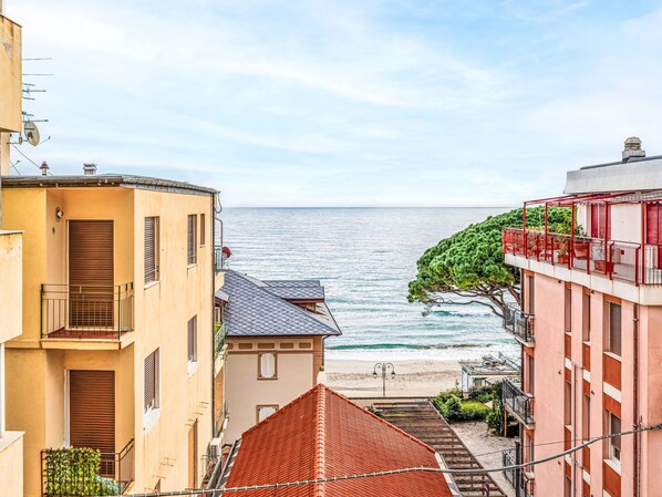 A coastal building with balconies overlooking the sea.