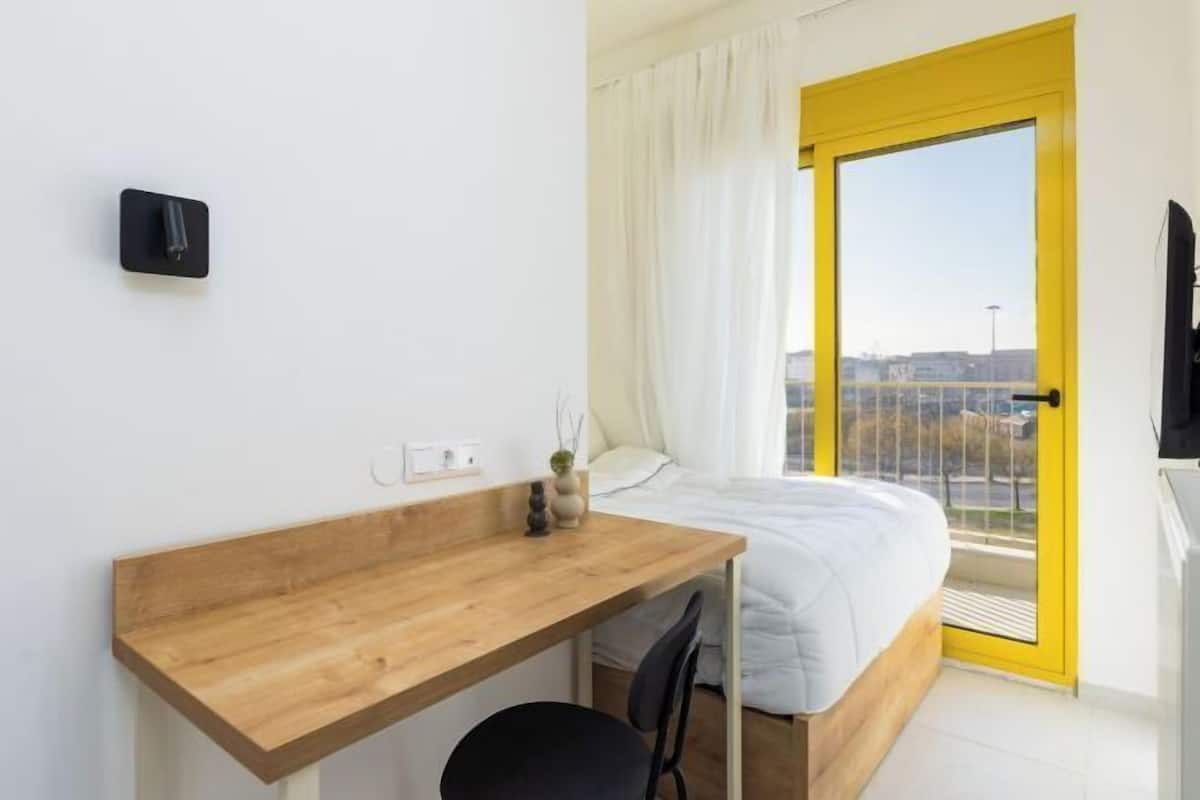 Desk, laptop workspace, blackout curtains, iron/ironing board