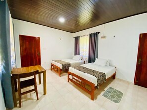 Deluxe Quadruple Room | In-room safe, desk, laptop workspace, soundproofing