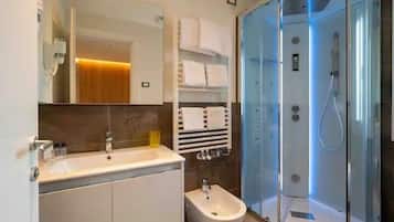 Apartment, 2 Bedrooms | Bathroom | Shower, hair dryer, towels, soap