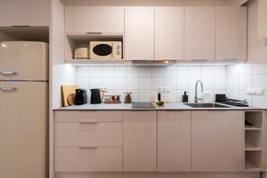 Fridge, microwave, stovetop, coffee/tea maker