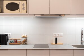Fridge, microwave, stovetop, coffee/tea maker