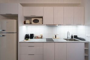 Fridge, microwave, stovetop, coffee/tea maker