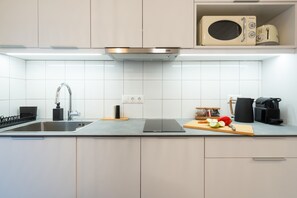 Fridge, microwave, stovetop, coffee/tea maker
