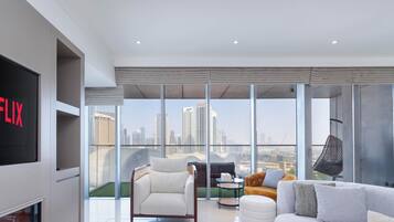 2-Bedroom Apartment with Panoramic Burj Khalifa and Fountain View | Living area | Flat-screen TV