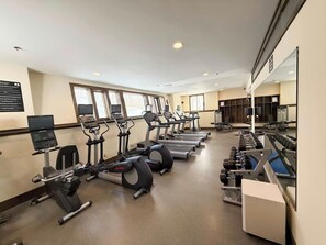 A gym with treadmills, elliptical machines, and weight machines. - Chimney Hill Haven | Close to Mt.Snow (Wilmington)