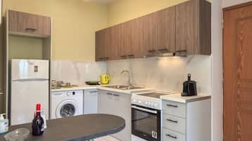 Basic Apartment, 1 Queen Bed with Sofa bed, Balcony, Beachfront | Private kitchen | Electric kettle