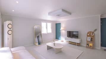 Luxury Villa (non-Korean nationals only) | Living area | Flat-screen TV