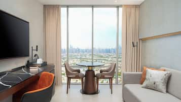 Executive Suite | Living area | 55-inch LED TV with satellite channels, Netflix, toys