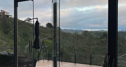 Glass house on the mountain in Macacos, close to waterfalls and ecological trails