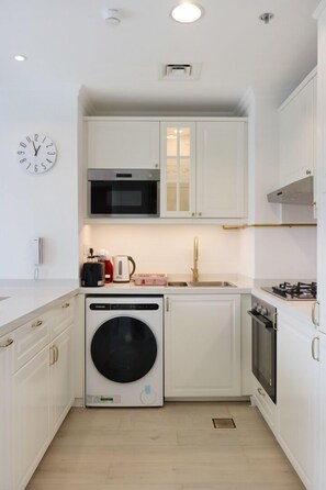 Fridge, microwave, stovetop, coffee/tea maker