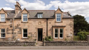A stone building with multiple windows and a central entrance. - Dalgety, Peebles - sleeping 8 guests in 4 bedrooms (Peebles)