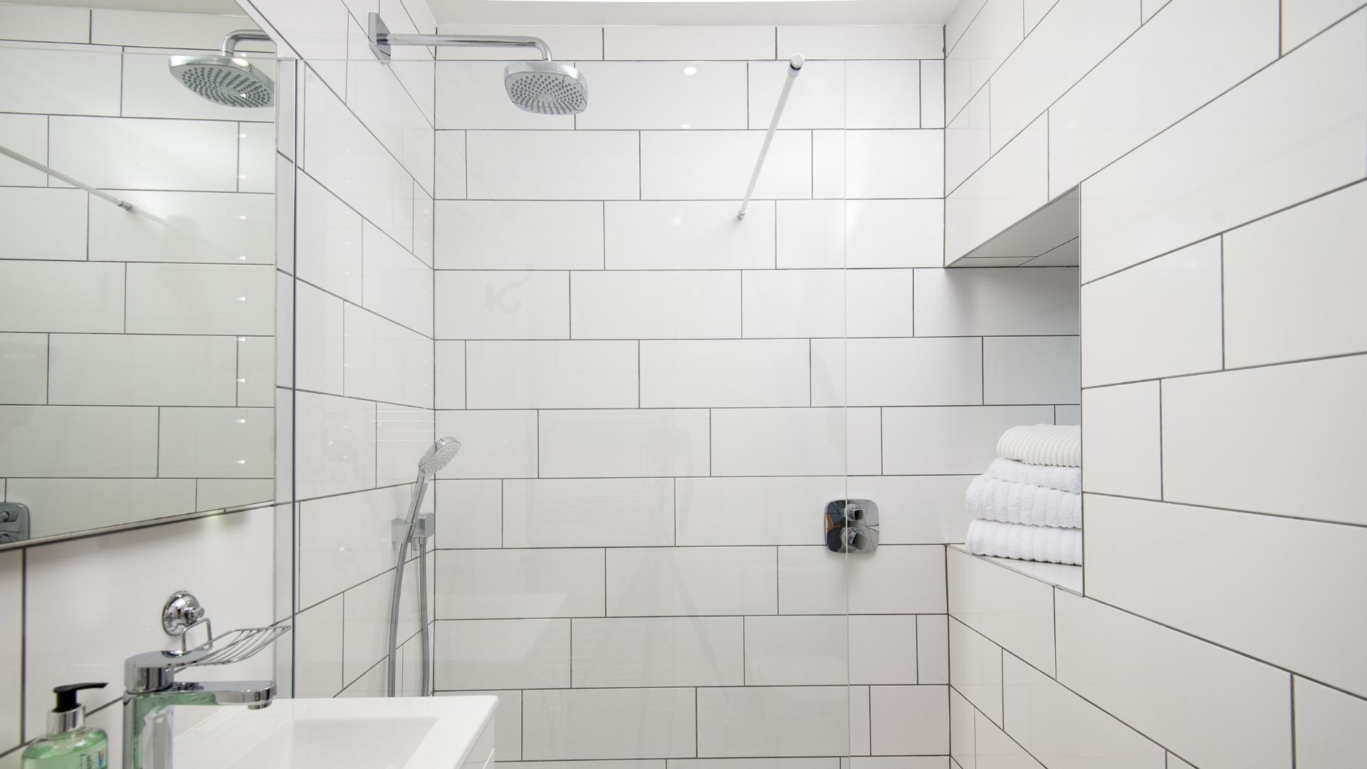 Shower, hair dryer, towels, toilet paper