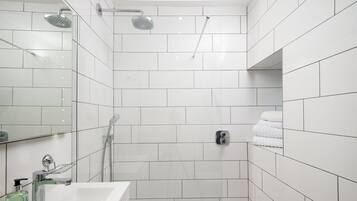 Shower, hair dryer, towels, toilet paper