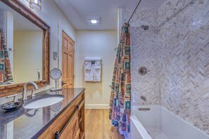Shower, jetted tub, hair dryer, towels