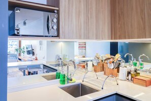 Fridge, microwave, stovetop, coffee/tea maker