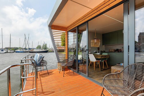 Houseboat Skoft with beautiful view over the water and on village Grou.