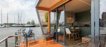 Houseboat Skoft with beautiful view over the water and on village Grou.