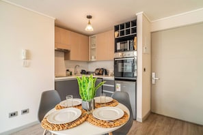Coffee/tea maker, fridge, microwave, oven