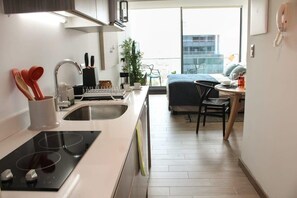 Fridge, microwave, stovetop, coffee/tea maker