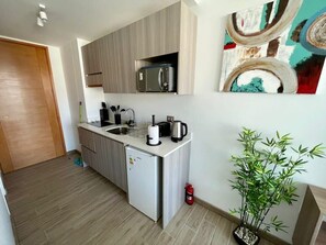 Fridge, microwave, stovetop, coffee/tea maker