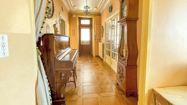 A hallway with a piano, a large wooden cabinet, and a door leading to another room. - L'Arpège du Puy - House* ParkingView * Family* 10min walk from Center (Le Puy-en-Velay)