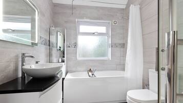 Shower, jetted bath, hair dryer, towels
