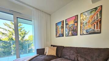 Apartamento conforto, sacada | Área de estar | TV LCD