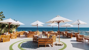 A beachside lounge with wooden furniture and white umbrellas, overlooking the ocean. - Diamond Beach (El Quseir)