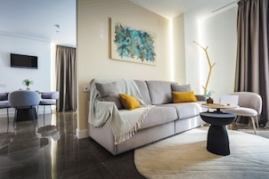 Luxury Suite, Balcony, City View | Living area | Flat-screen TV
