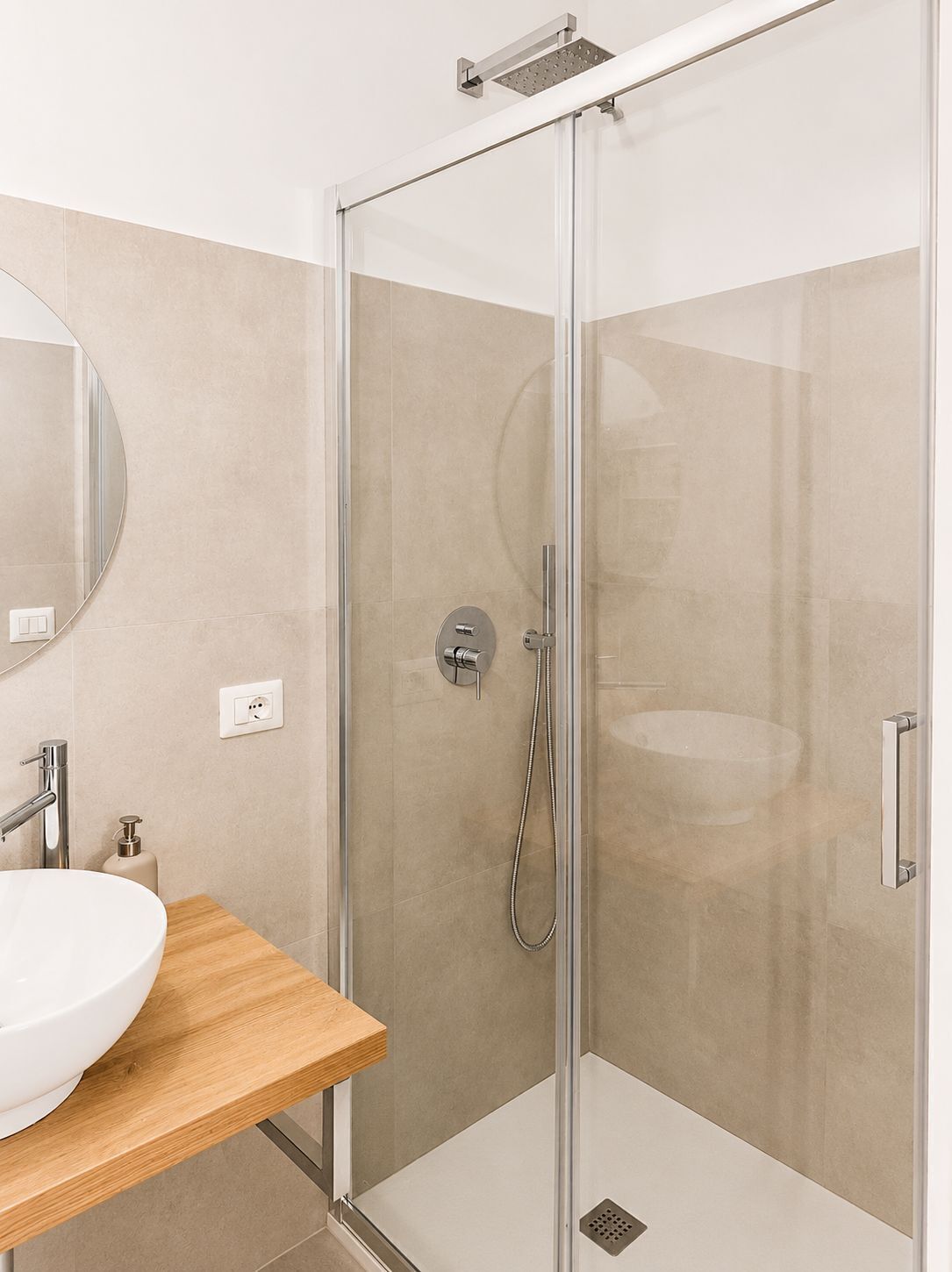 Private bathroom with walk-in shower, modern vanity, and complimentary essentials, exclusively serving Bedroom 2.