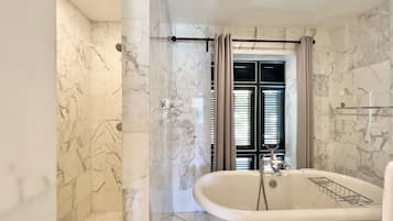 Shower, hair dryer, towels, toilet paper