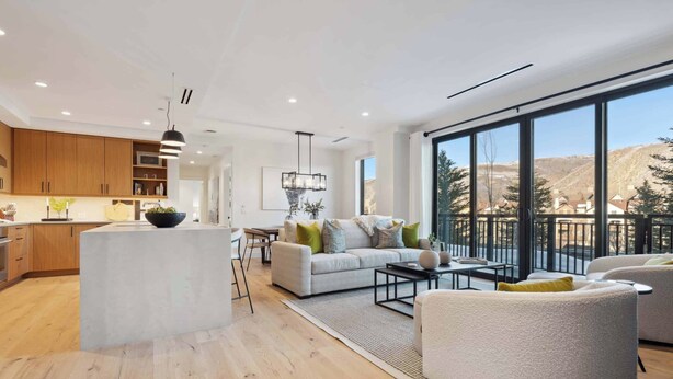 A modern living space with a kitchen, a dining area, and a seating area with a view. - Frontgate 228 - 3 Bedroom Residence (Avon)