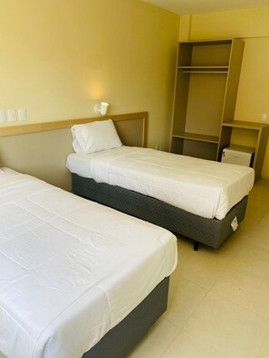 Quarto solteiro luxo, vista para a cidade | Wi-Fi de cortesia, roupa de cama