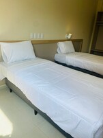 Quarto solteiro luxo, vista para a cidade | Wi-Fi de cortesia, roupa de cama