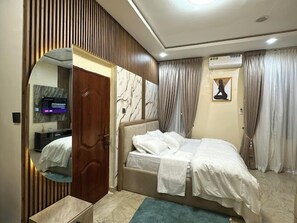 Deluxe Apartment, Balcony, City View | In-room safe, desk, laptop workspace, blackout drapes - The Jericho Apartments (Ibadan)