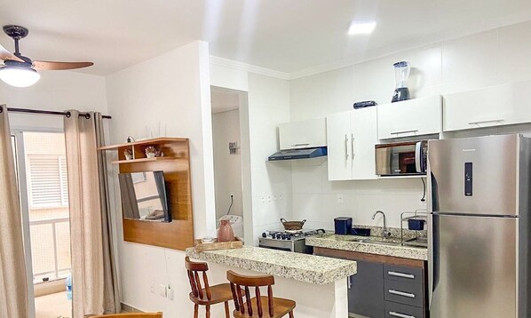 Fridge, microwave, oven, cookware/dishes/utensils