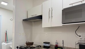 Fridge, microwave, oven, cookware/dishes/utensils