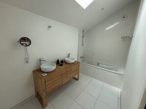 Shower, hair dryer, towels, toilet paper