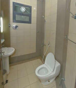 Separate bathtub and shower, towels, soap, shampoo