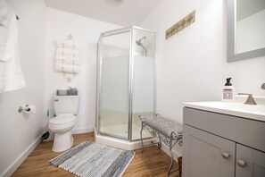 Shower, hair dryer, towels, soap