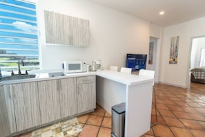 Fridge, microwave, stovetop, coffee/tea maker